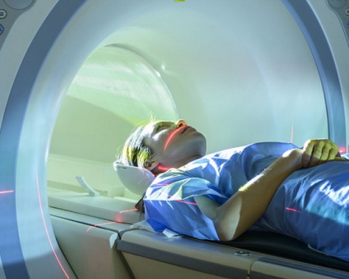 Patient entering Magnetic Resonance Imaging (MRI) scanner